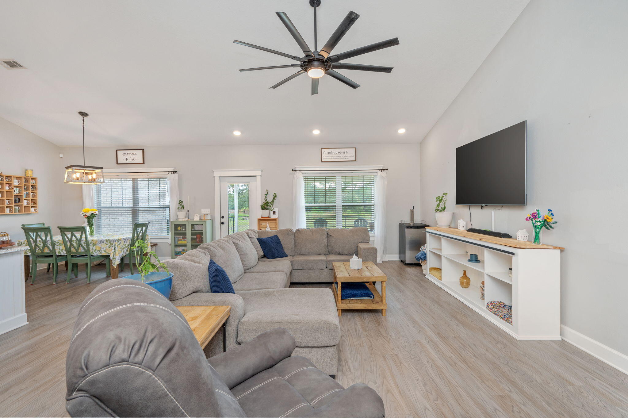 7934 Steel Mill Creek Road Laurel Hill, FL 32567 - Photo 11 of 63 a living room with furniture and a flat screen tv