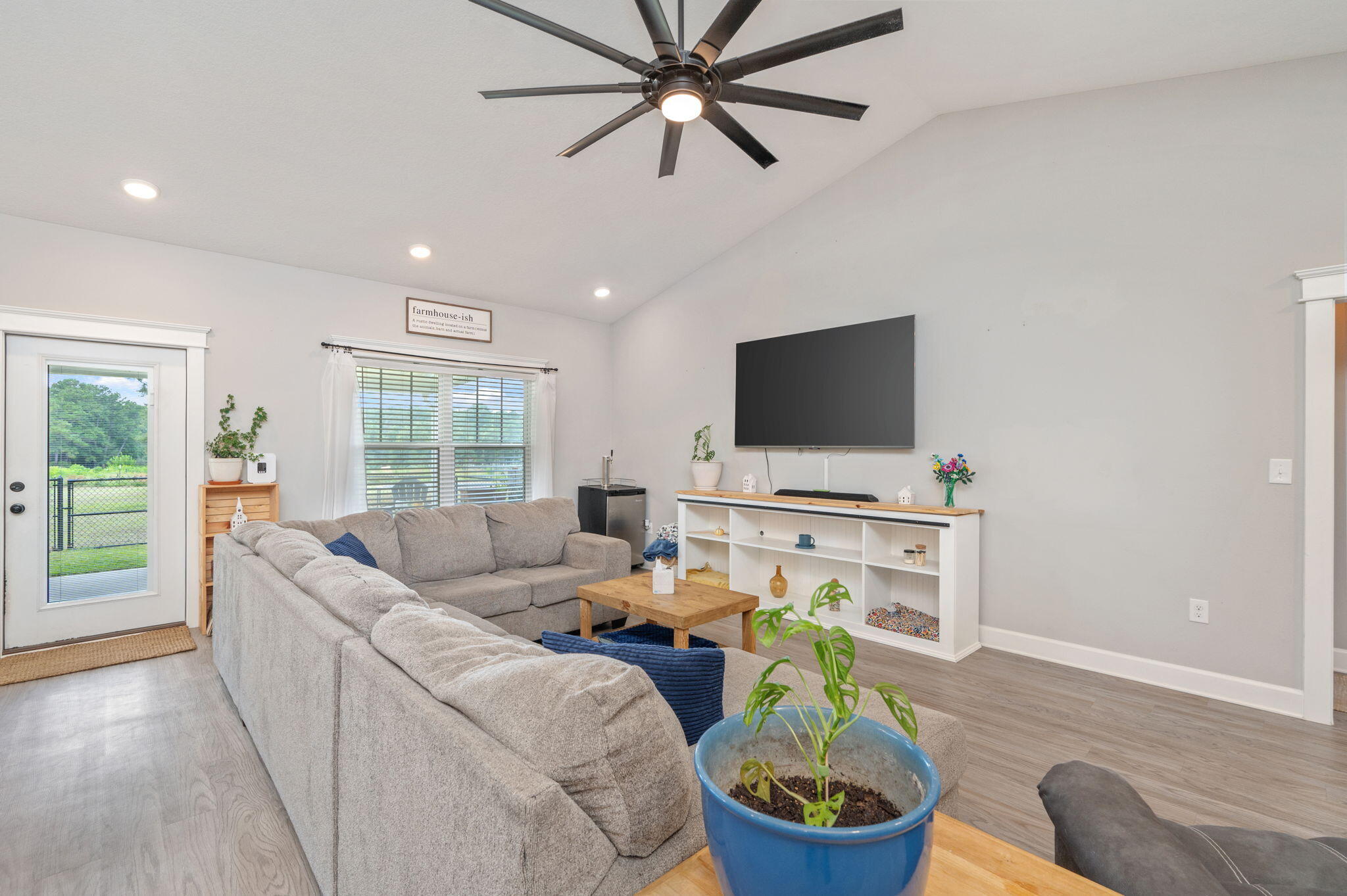 7934 Steel Mill Creek Road Laurel Hill, FL 32567 - Photo 12 of 63 a living room with furniture and a flat screen tv