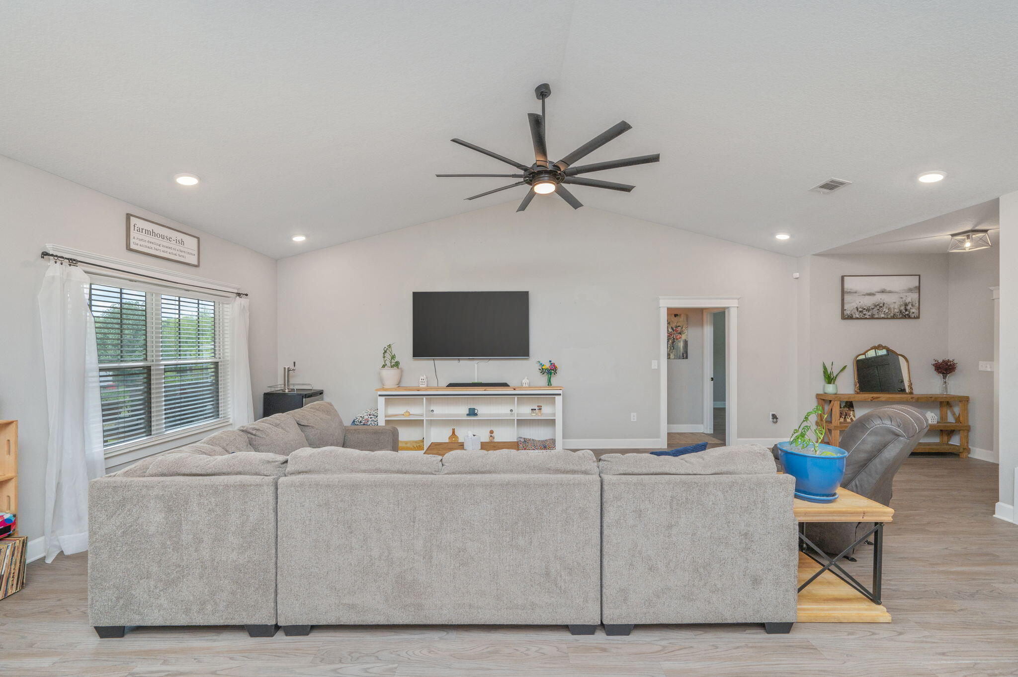 7934 Steel Mill Creek Road Laurel Hill, FL 32567 - Photo 13 of 63 a living room with furniture and a flat screen tv