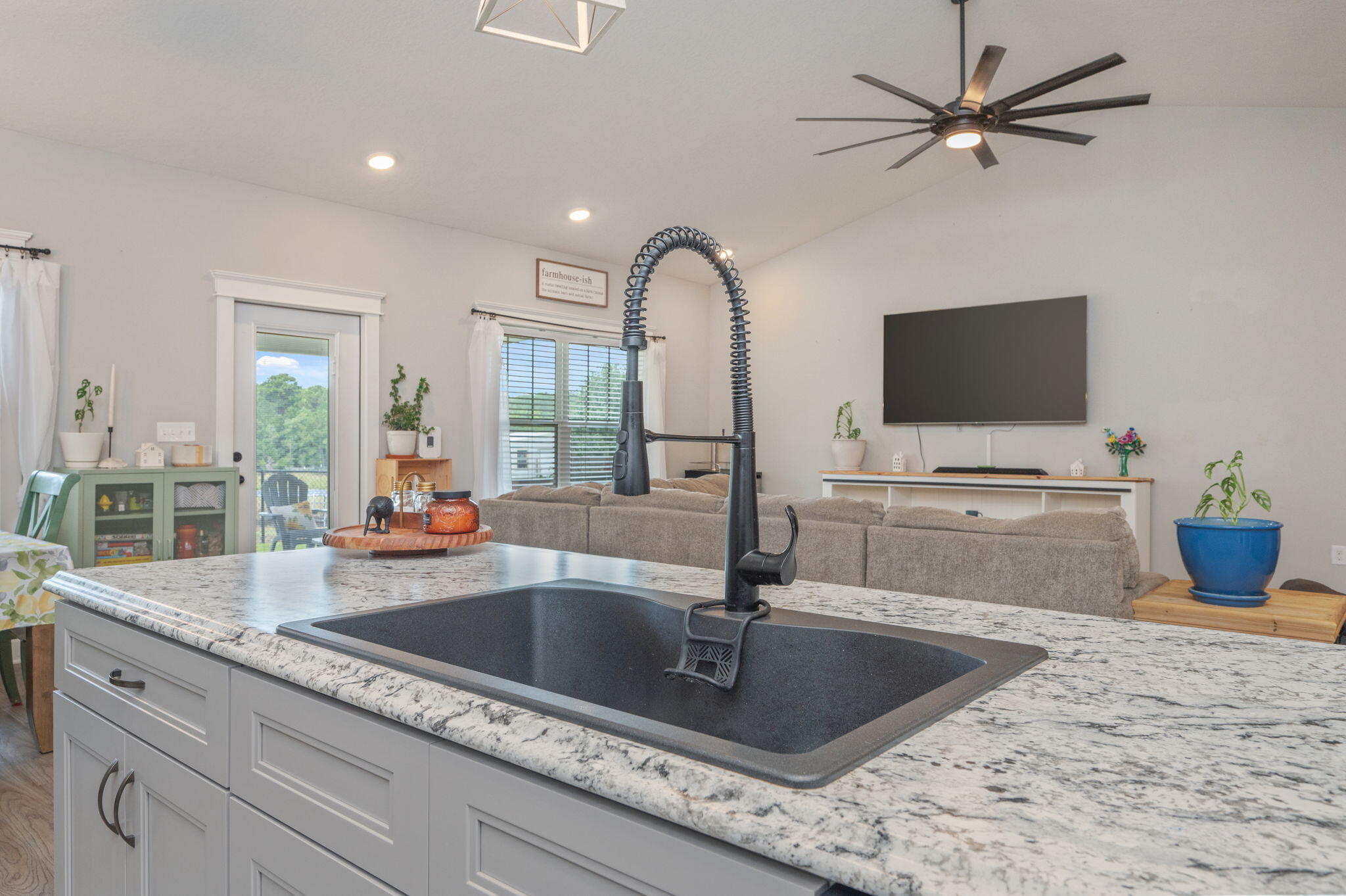 7934 Steel Mill Creek Road Laurel Hill, FL 32567 - Photo 21 of 63 a kitchen with a faucet a sink and cabinets