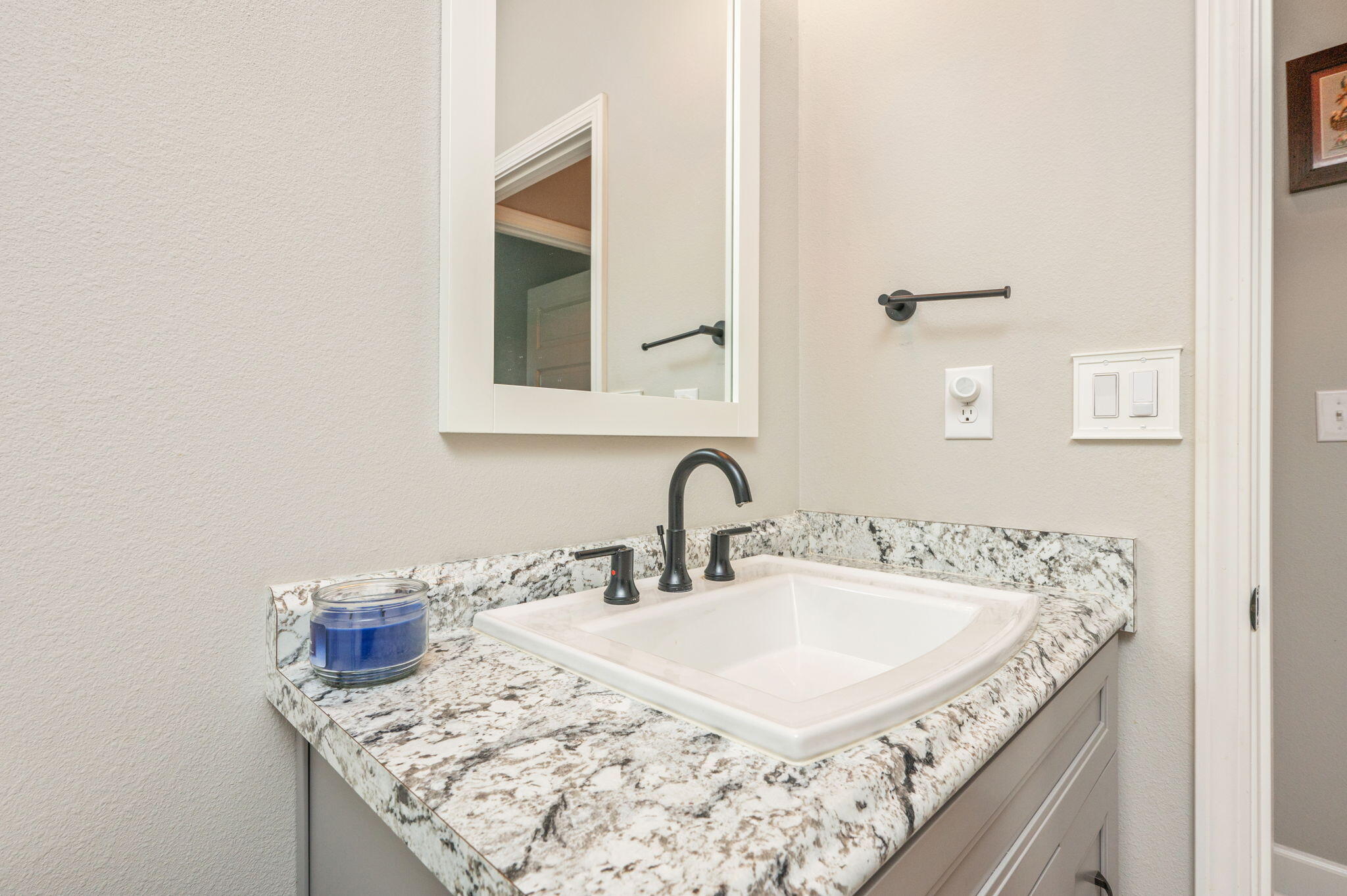 7934 Steel Mill Creek Road Laurel Hill, FL 32567 - Photo 39 of 63 a bathroom with a granite countertop sink and a mirror
