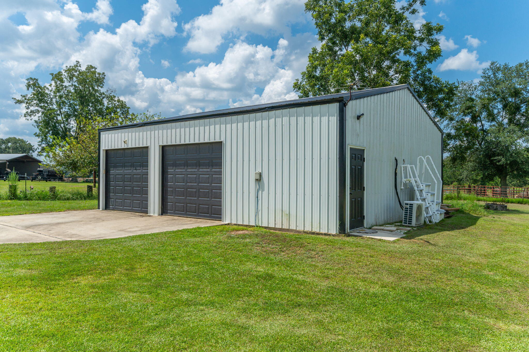 7934 Steel Mill Creek Road Laurel Hill, FL 32567 - Photo 47 of 63 a view of a backyard with a large tree