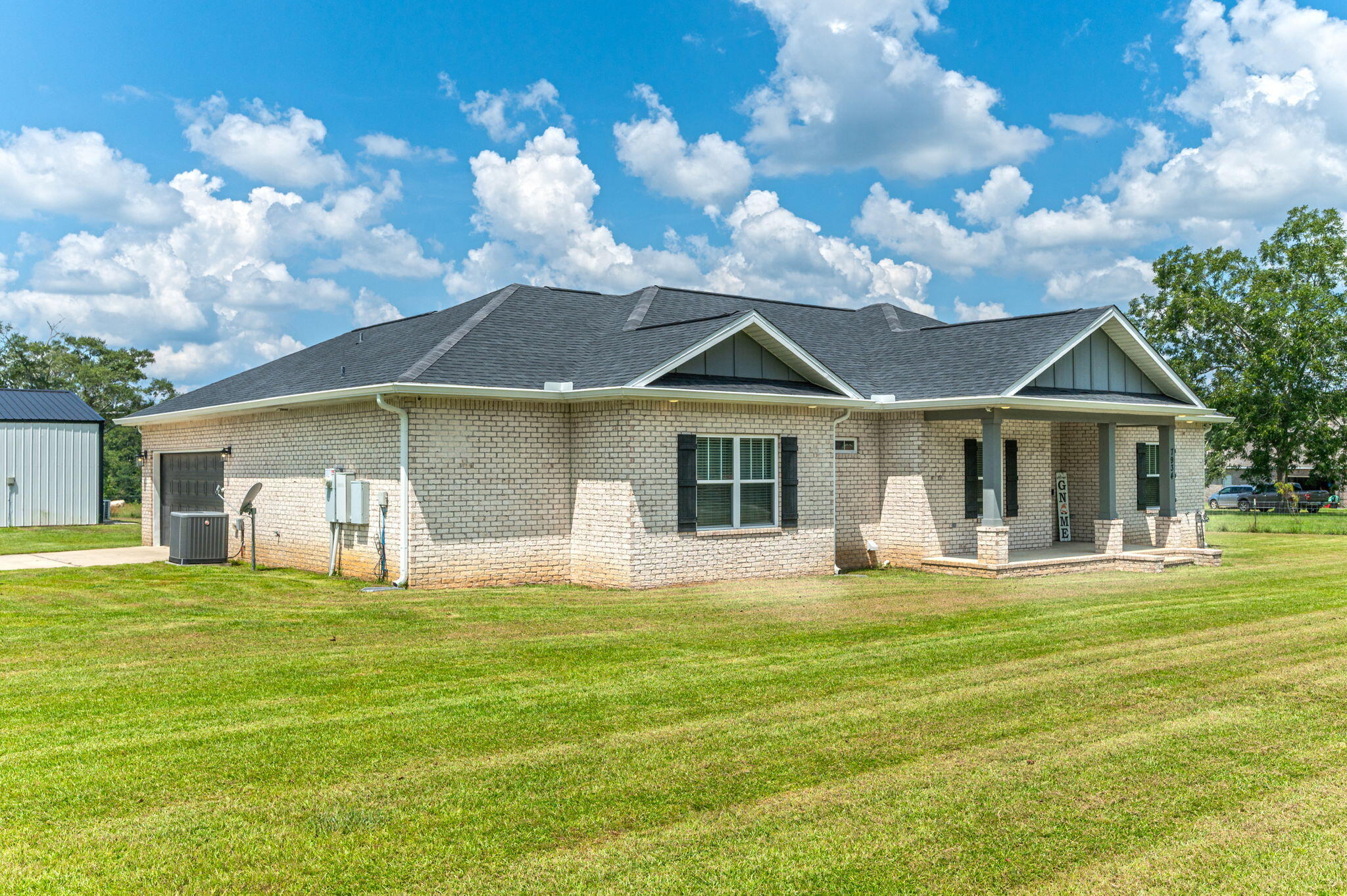 7934 Steel Mill Creek Road Laurel Hill, FL 32567 - Photo 5 of 63 a front view of a house with a yard