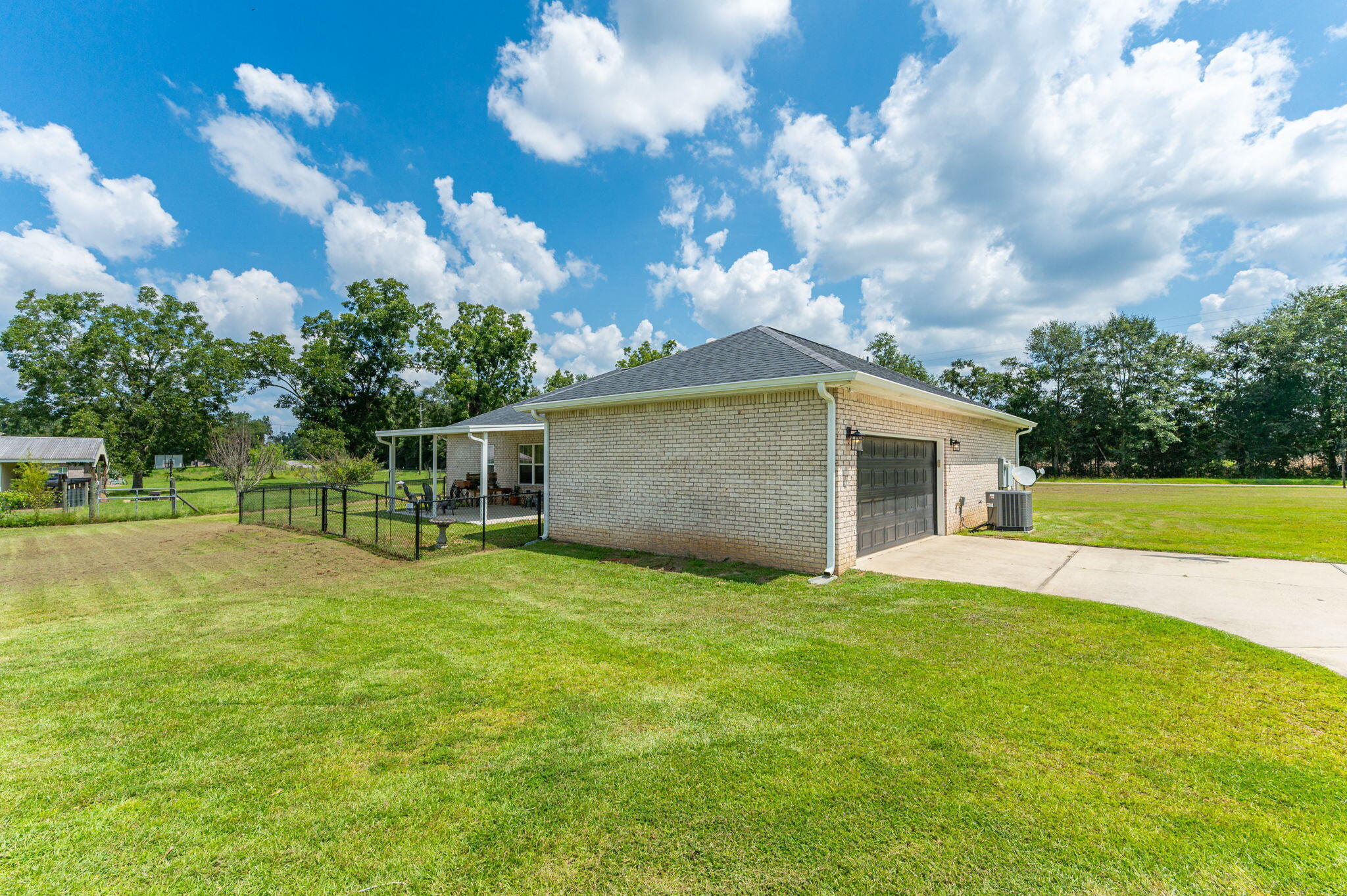 7934 Steel Mill Creek Road Laurel Hill, FL 32567 - Photo 53 of 63 a view of a house with a yard