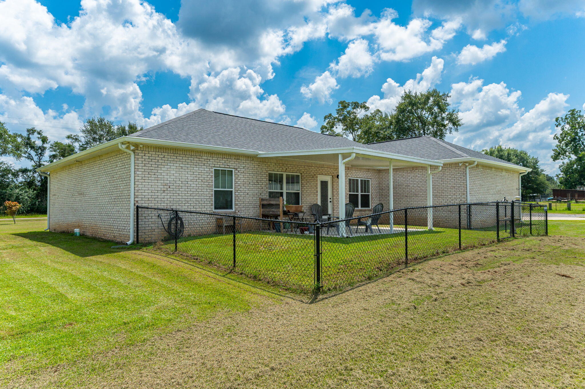 7934 Steel Mill Creek Road Laurel Hill, FL 32567 - Photo 55 of 63 a view of house with backyard