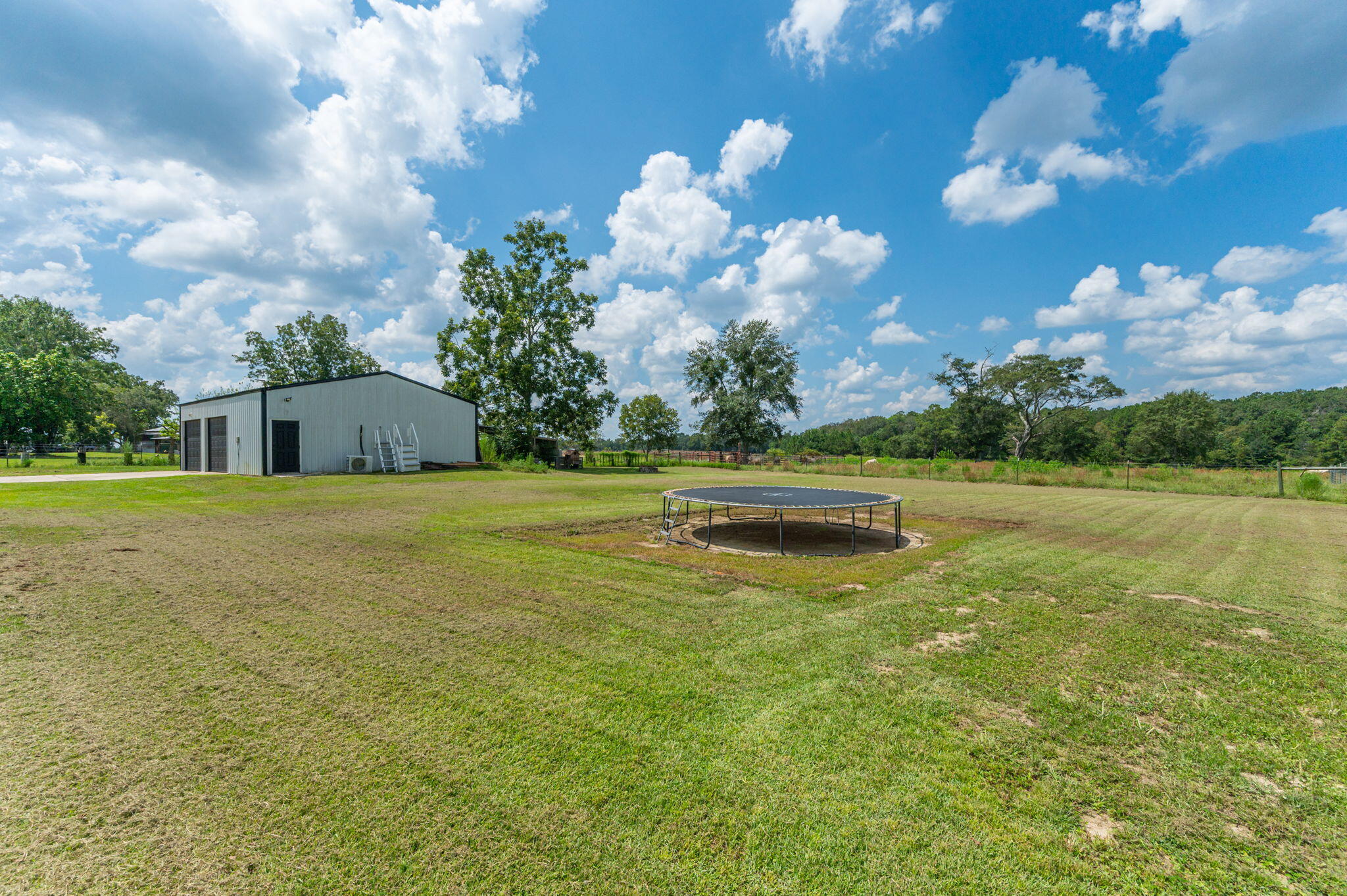7934 Steel Mill Creek Road Laurel Hill, FL 32567 - Photo 56 of 63 a view of a playground with basketball court