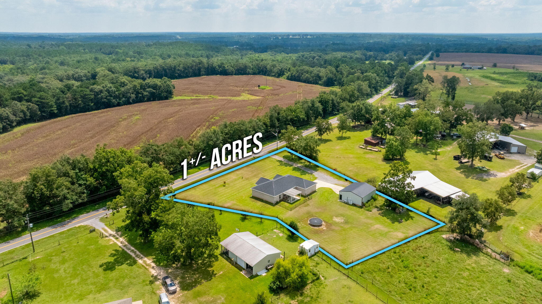 7934 Steel Mill Creek Road Laurel Hill, FL 32567 - Photo 58 of 63 an aerial view of a tennis court