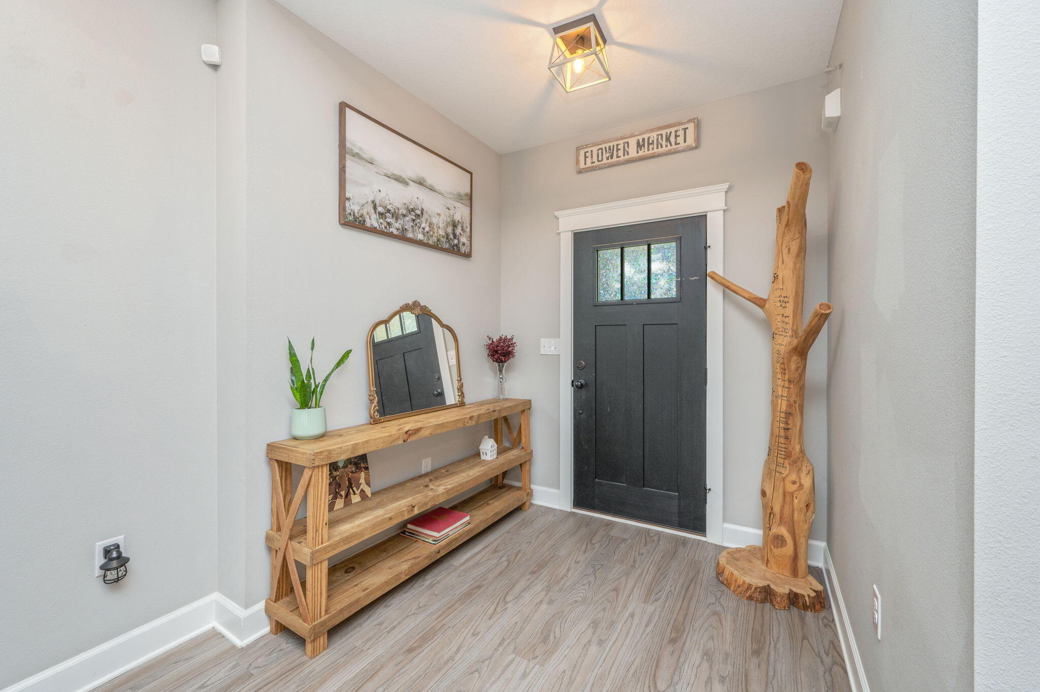 7934 Steel Mill Creek Road Laurel Hill, FL 32567 - Photo 9 of 63 a view of hallway with stairs and wooden floor