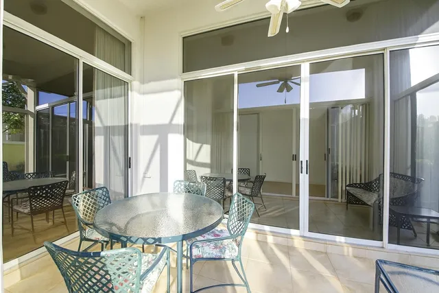 a dining room with a table and chairs