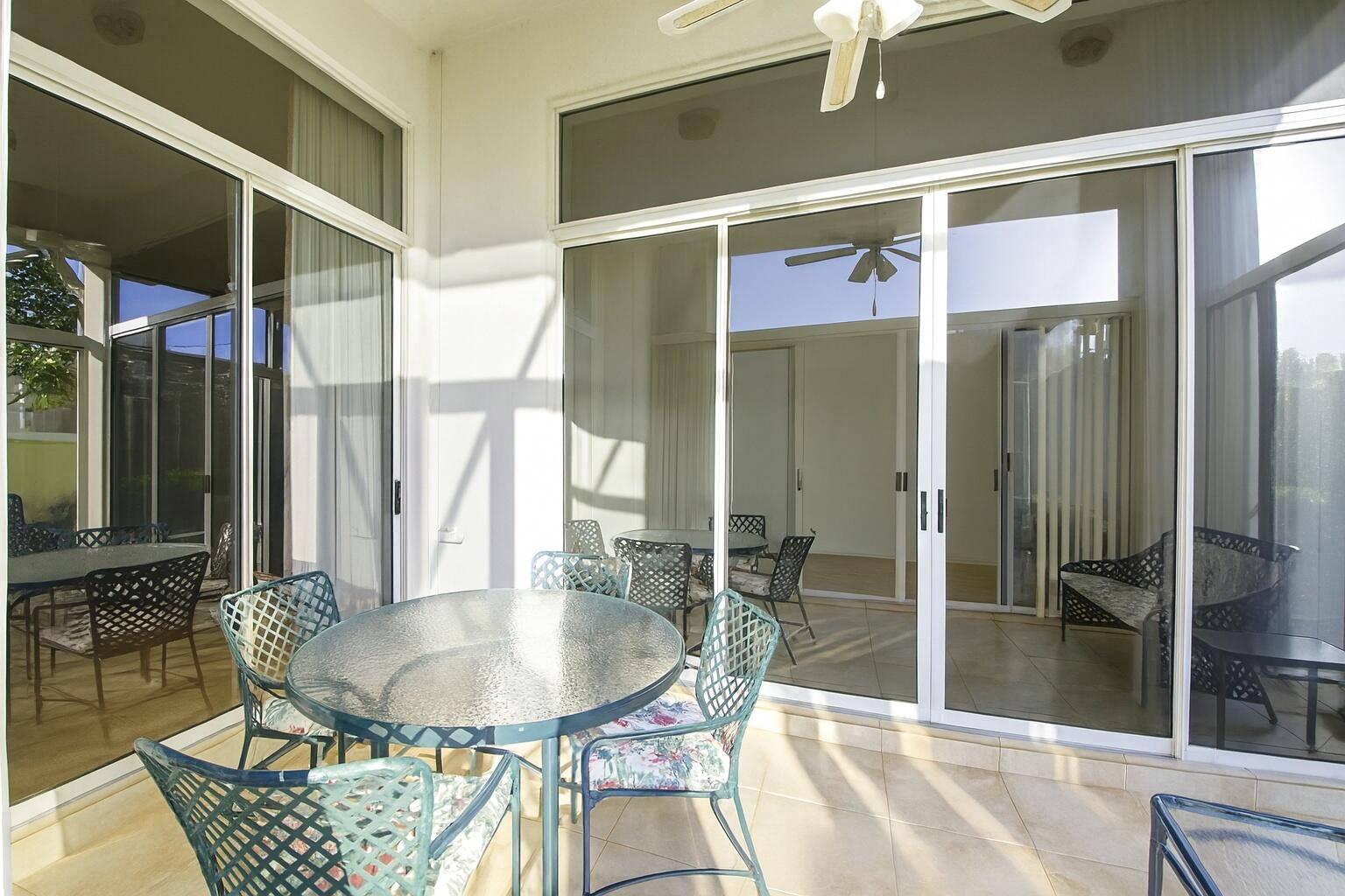 7737 Rockford Road Boynton Beach, FL 33472 - Photo 16 of 29 a dining room with a table and chairs