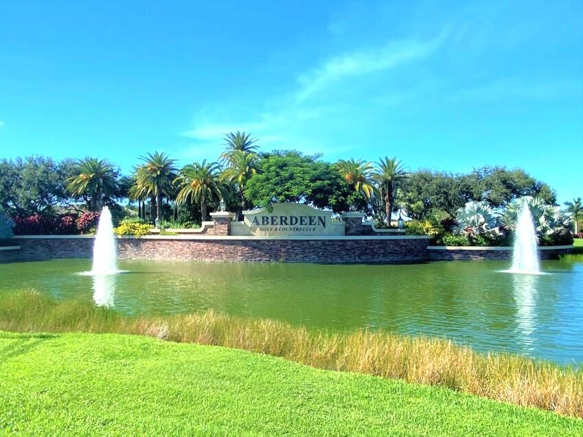 7737 Rockford Road Boynton Beach, FL 33472 - Photo 20 of 29 a view of a lake with houses in the back