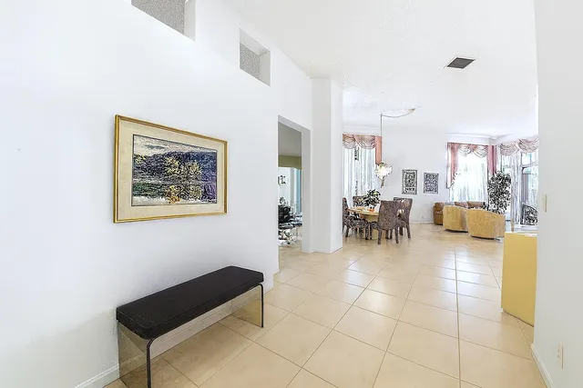 a lobby with furniture and a dining table