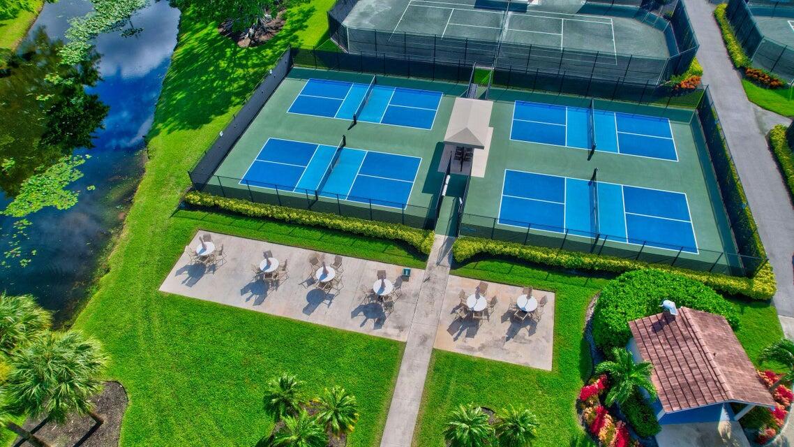 7737 Rockford Road Boynton Beach, FL 33472 - Photo 24 of 29 a backyard of a house with lots of green space