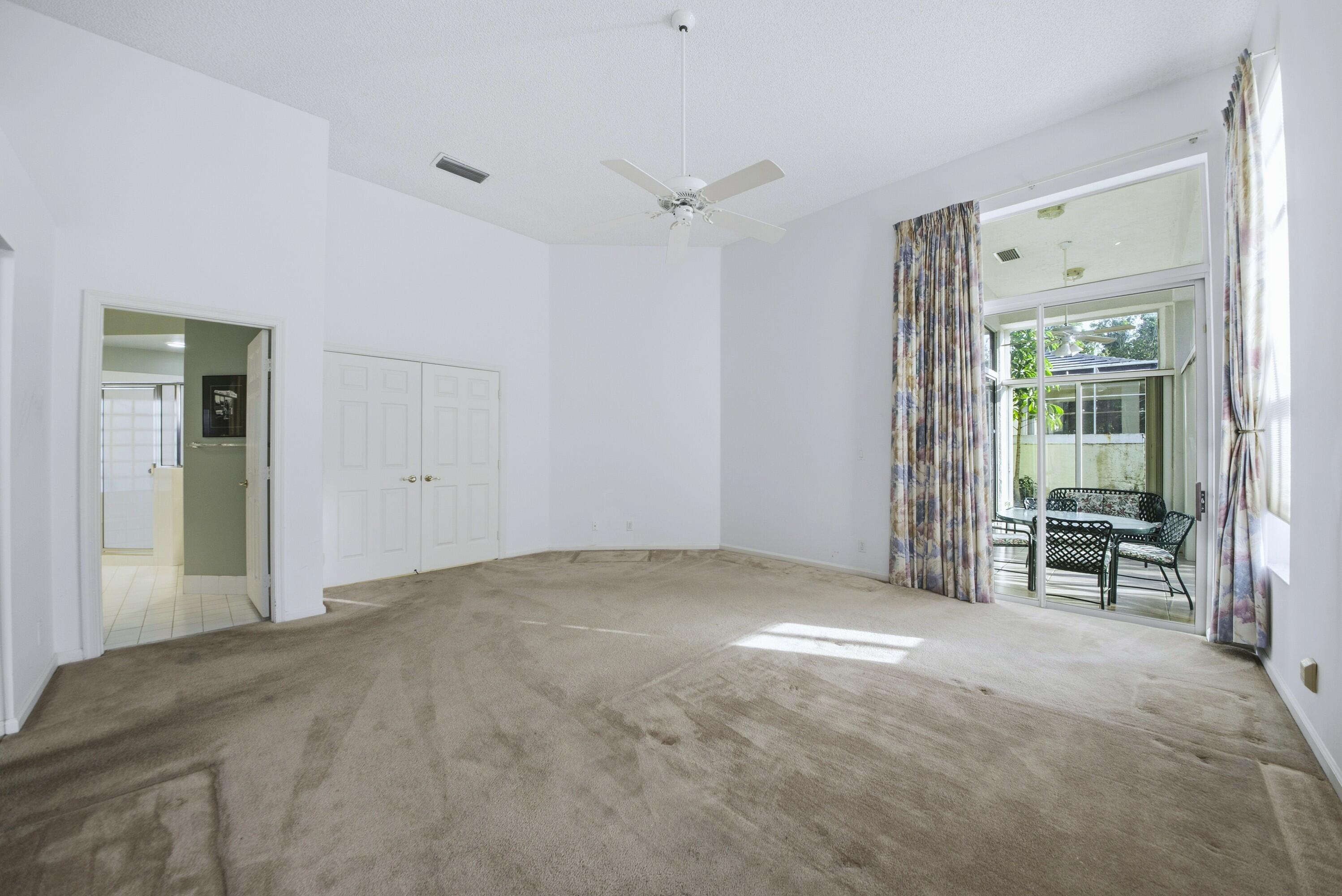 7737 Rockford Road Boynton Beach, FL 33472 - Photo 9 of 29 a view of an empty room with a window