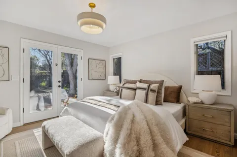 a bedroom with a balcony a bed and a couch