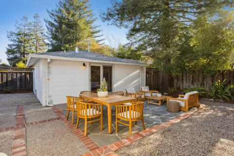 a bedroom with furniture and wooden floor