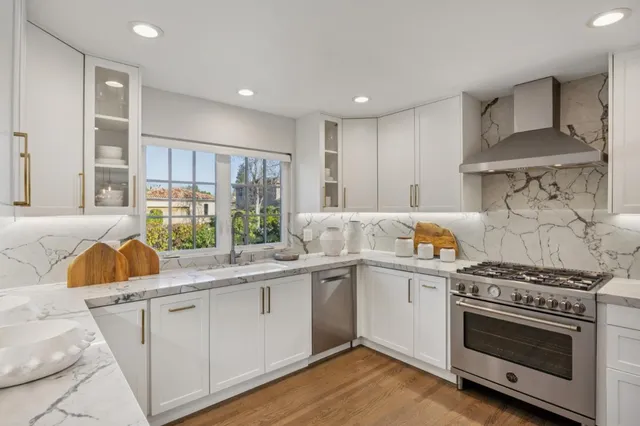 a living room with furniture large window and flat screen tv