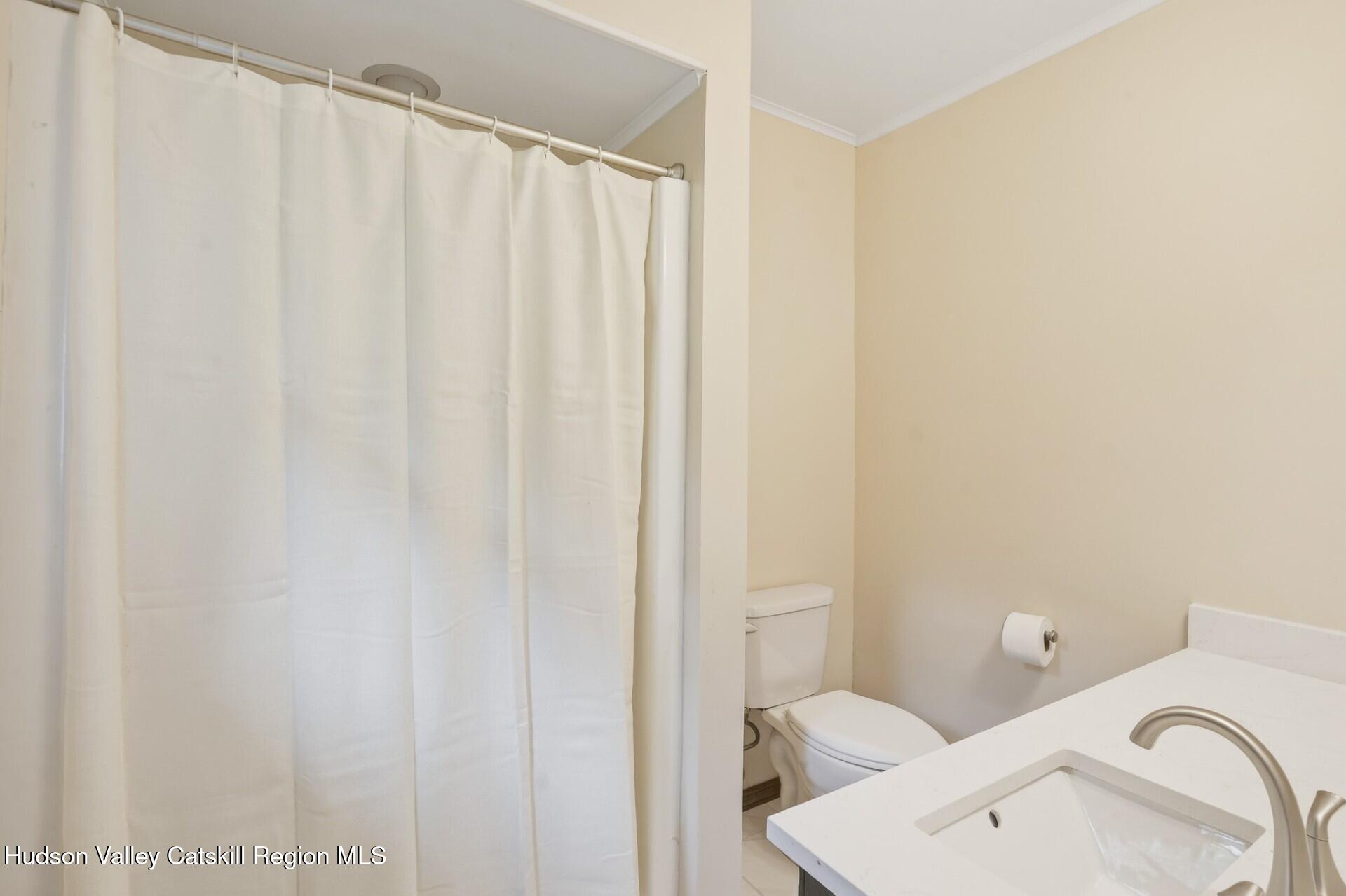 984 Blue Mountain Road Saugerties, NY 12477 - Photo 16 of 24 a bathroom with a sink and toilet