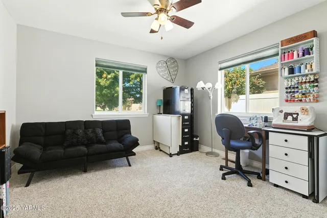 a living room with furniture and a window
