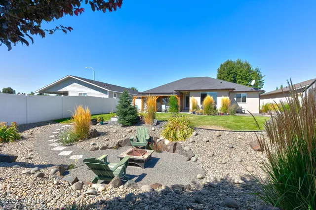 a view of backyard with outdoor seating