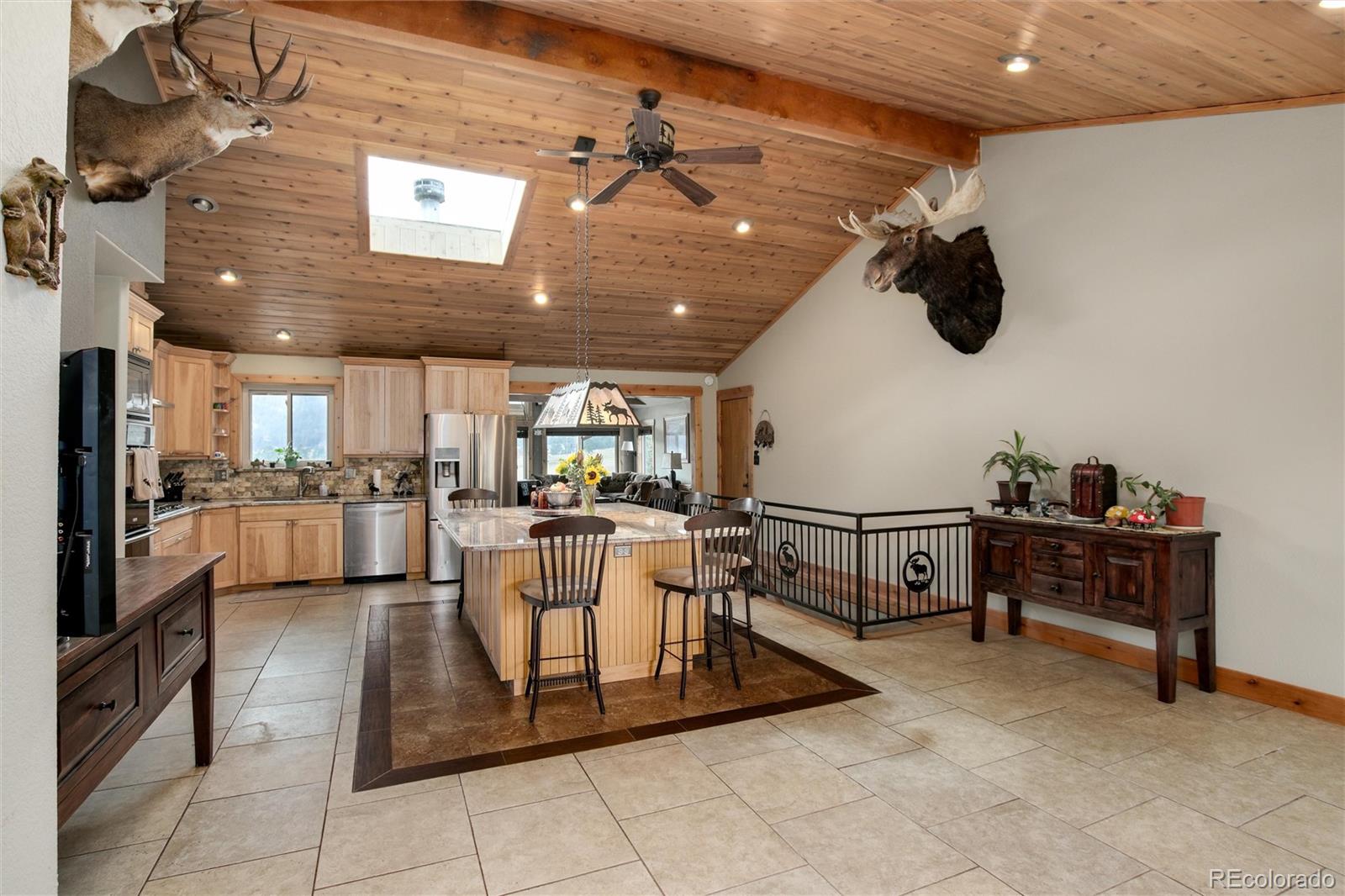 23724 Moqui Road Indian Hills, CO 80454 - Photo 11 of 39 a living room with furniture