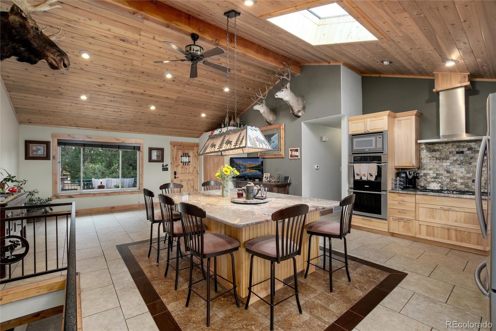 23724 Moqui Road Indian Hills, CO 80454 - Photo 15 of 39 a view of a dining room with furniture