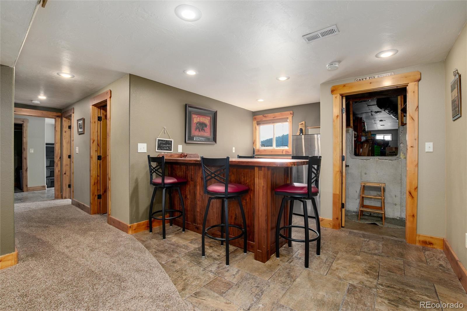 23724 Moqui Road Indian Hills, CO 80454 - Photo 30 of 39 a view of a dining area with furniture