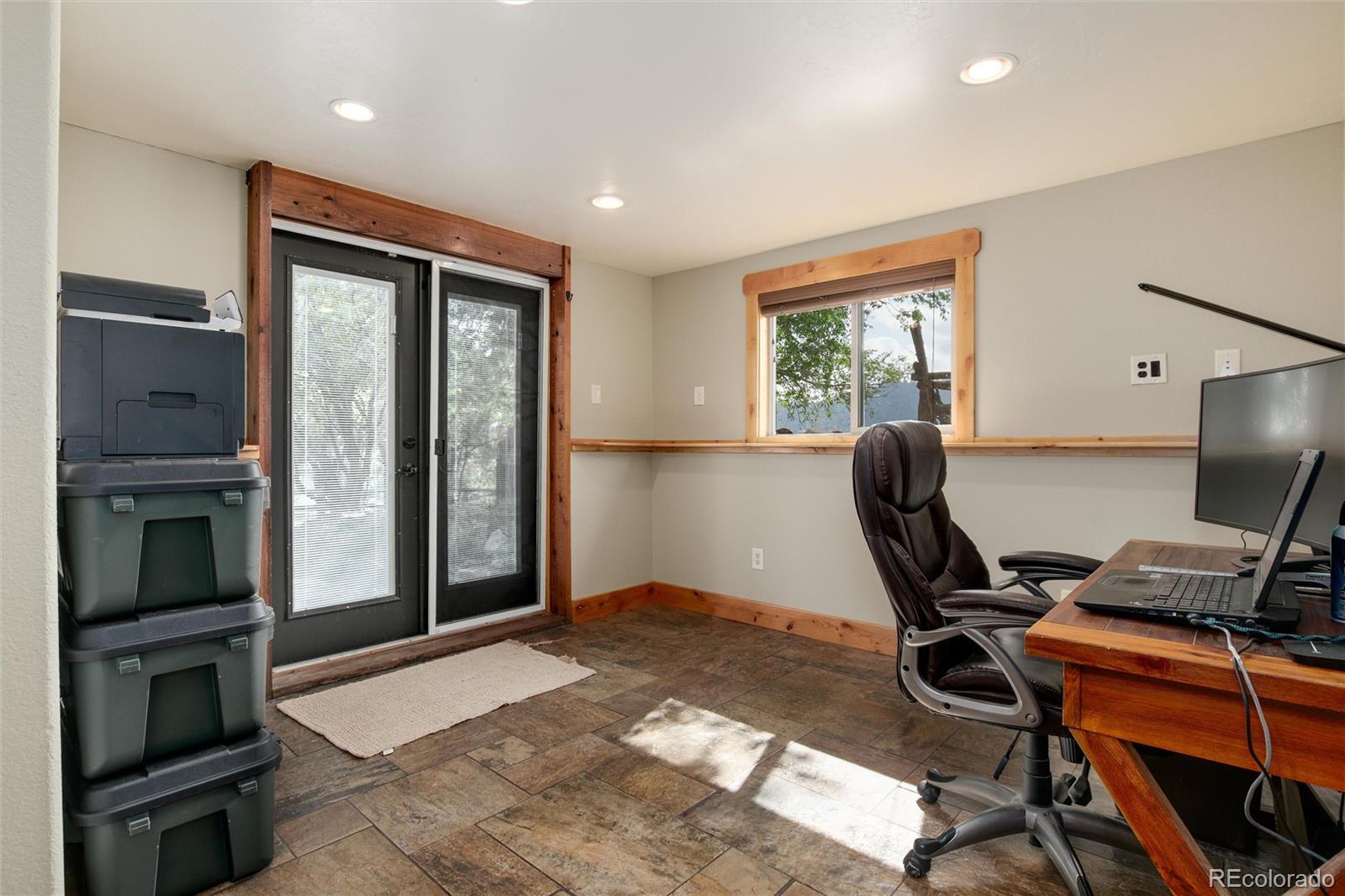23724 Moqui Road Indian Hills, CO 80454 - Photo 31 of 39 a workspace with furniture and a window
