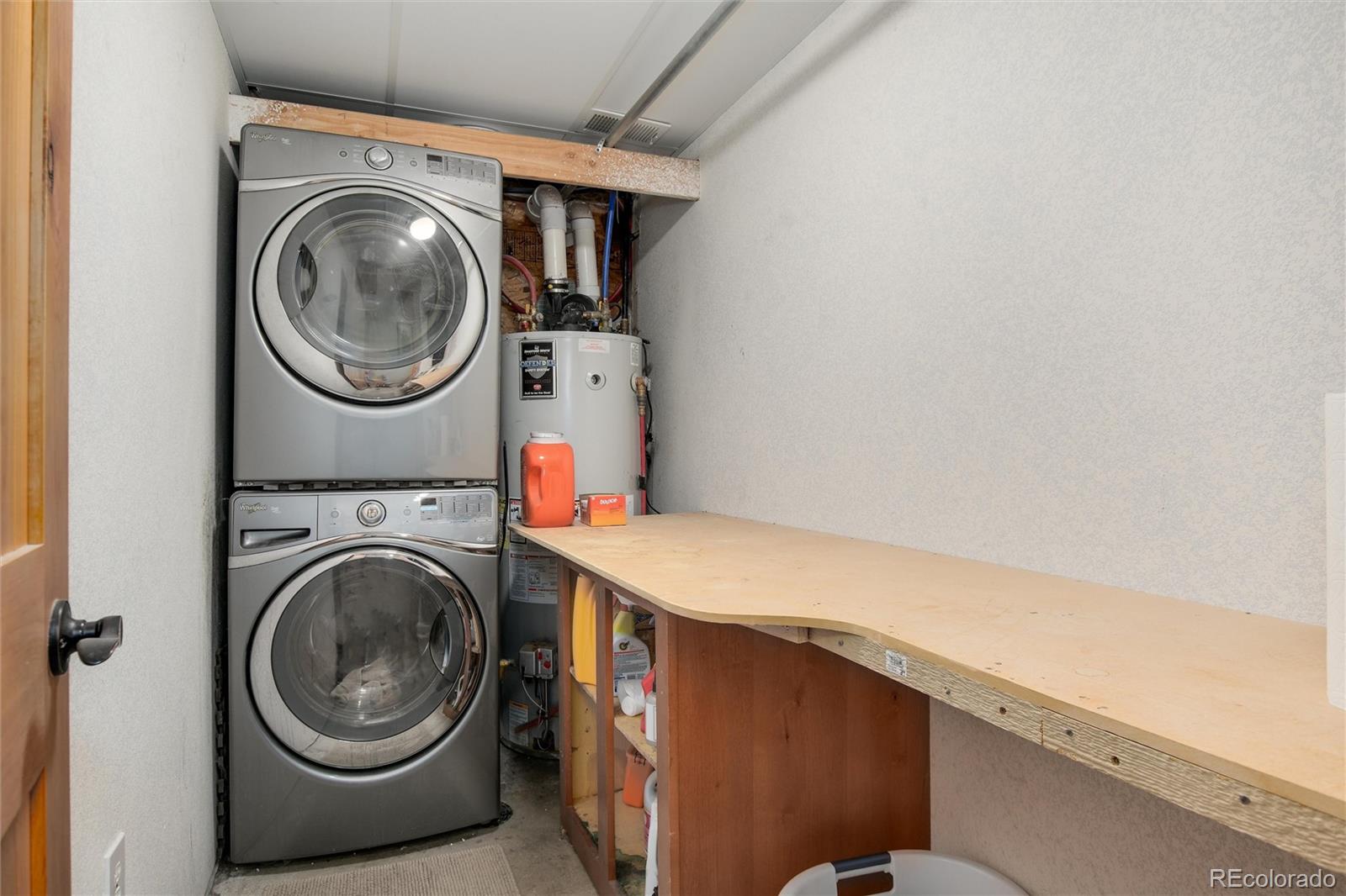 23724 Moqui Road Indian Hills, CO 80454 - Photo 32 of 39 a utility room with dryer and washer
