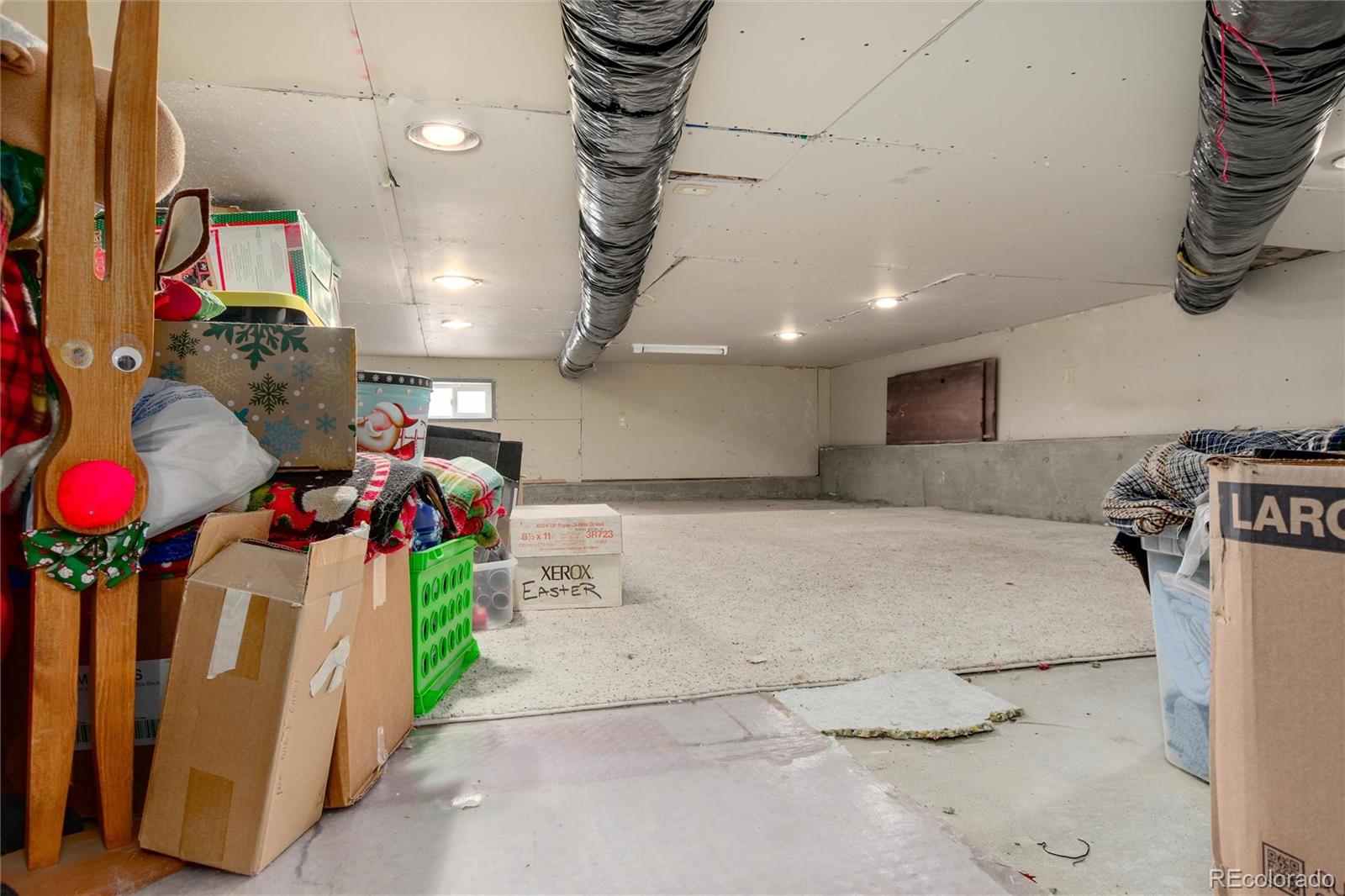 23724 Moqui Road Indian Hills, CO 80454 - Photo 33 of 39 a bedroom with furniture and a clock