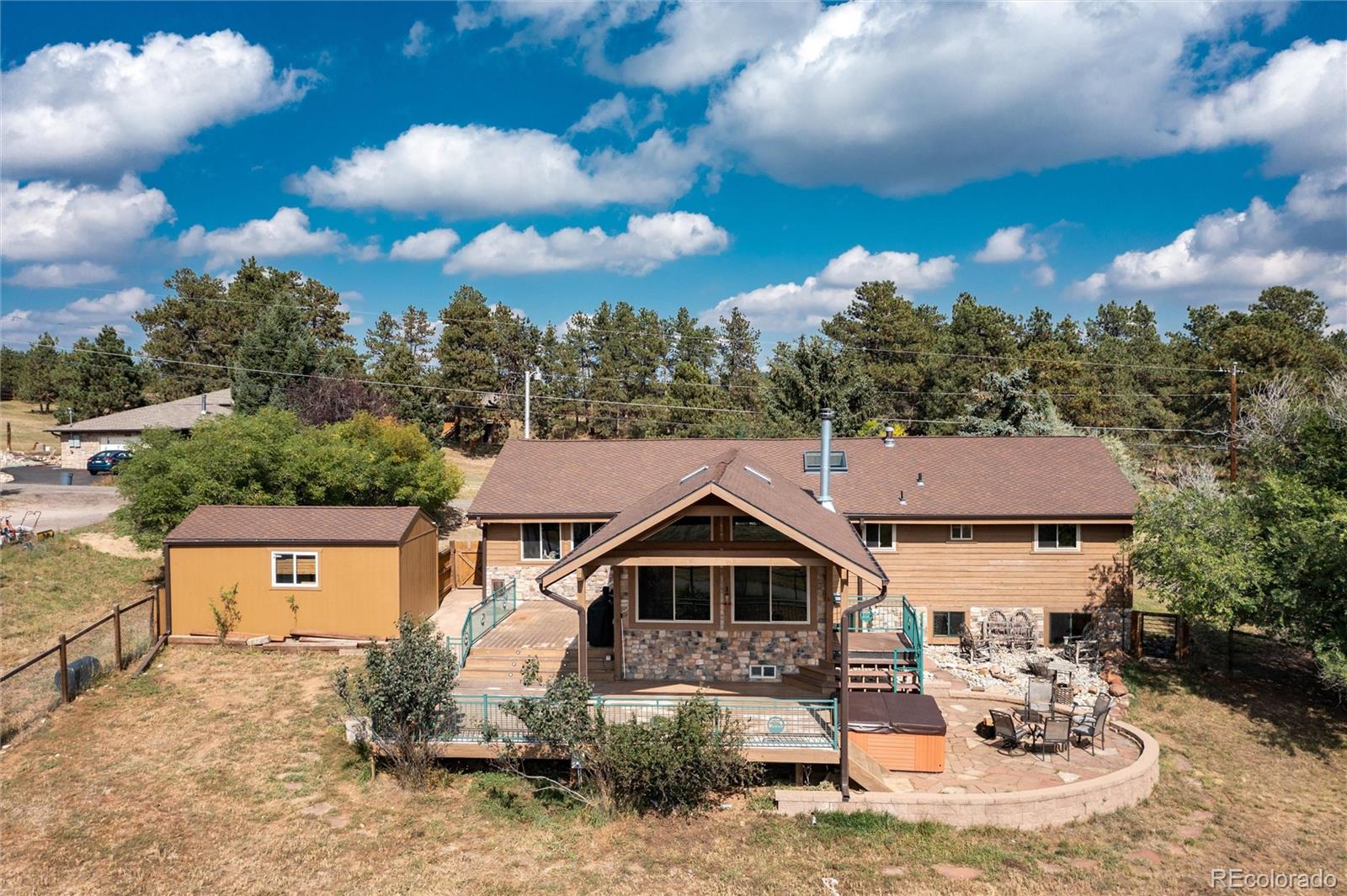23724 Moqui Road Indian Hills, CO 80454 - Photo 5 of 39 a view of a house with a yard