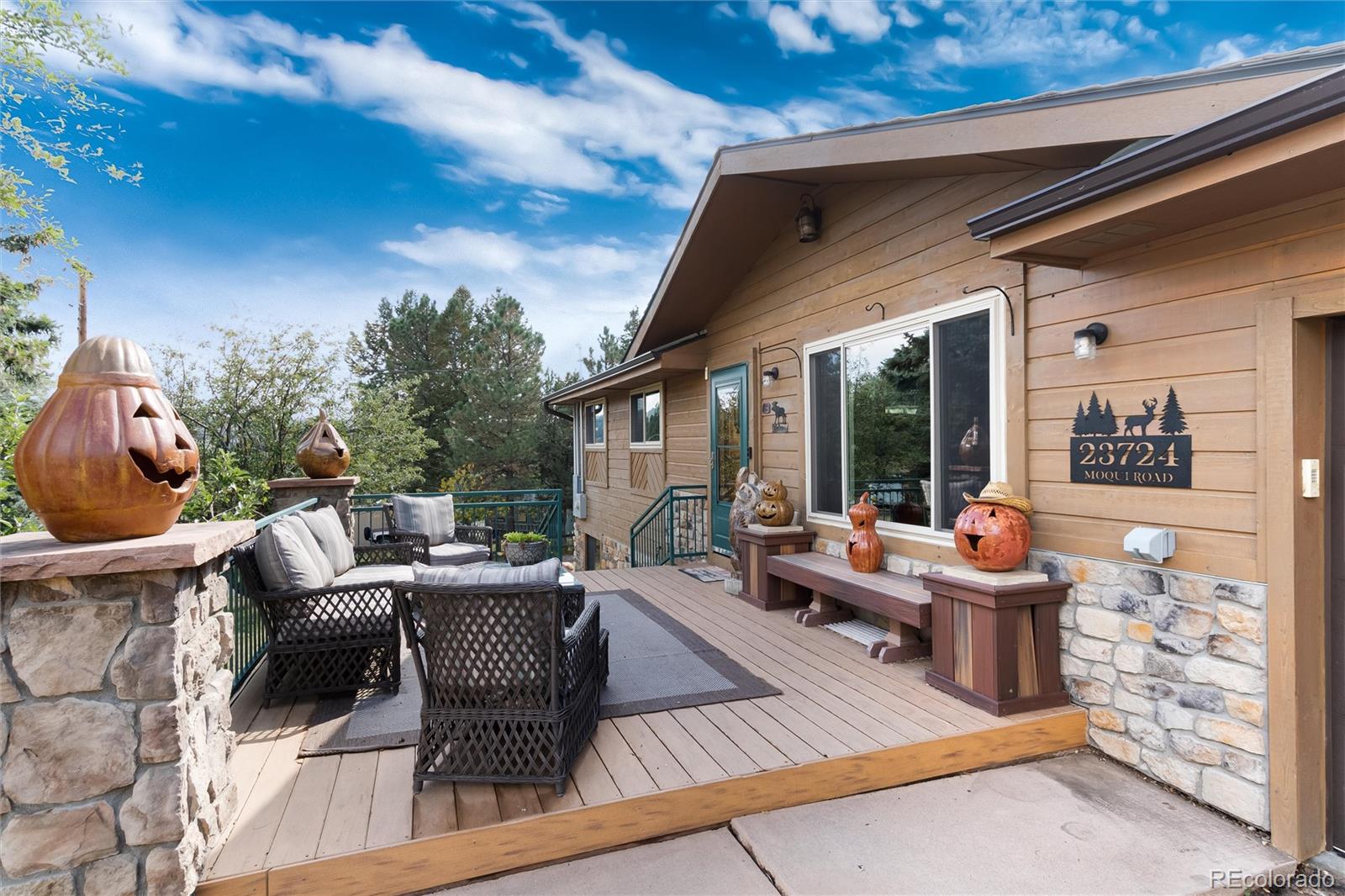 23724 Moqui Road Indian Hills, CO 80454 - Photo 8 of 39 a outdoor living space with furniture and garden view