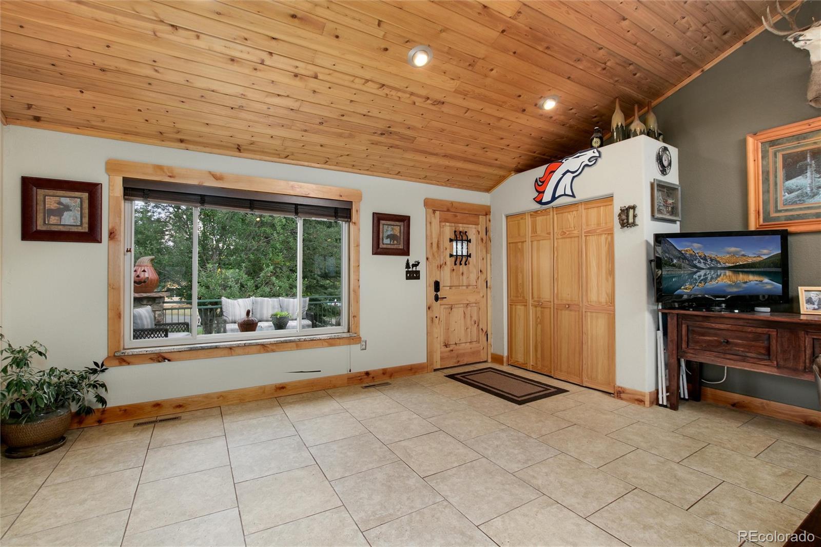 23724 Moqui Road Indian Hills, CO 80454 - Photo 10 of 39 a very nice looking room with a large window