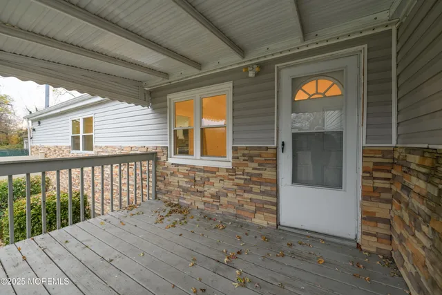 a view of balcony with wooden floor