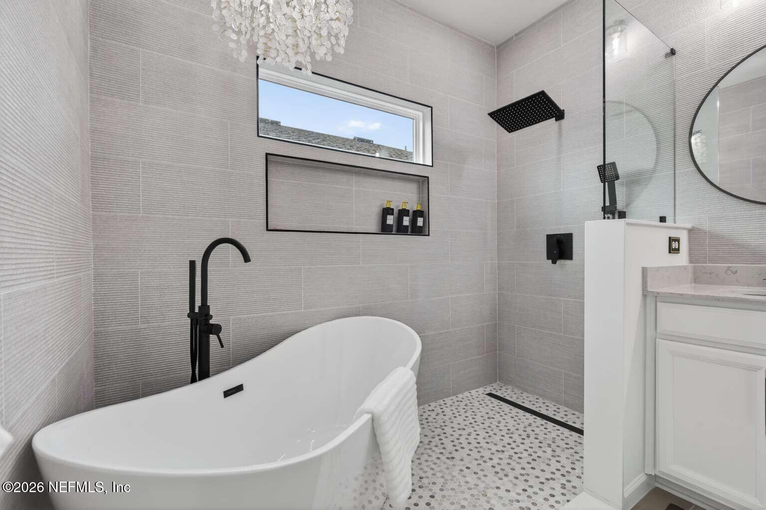 339 Gan Way St. Johns, FL 32259 - Photo 12 of 20 a bathroom with a bathtub and shower