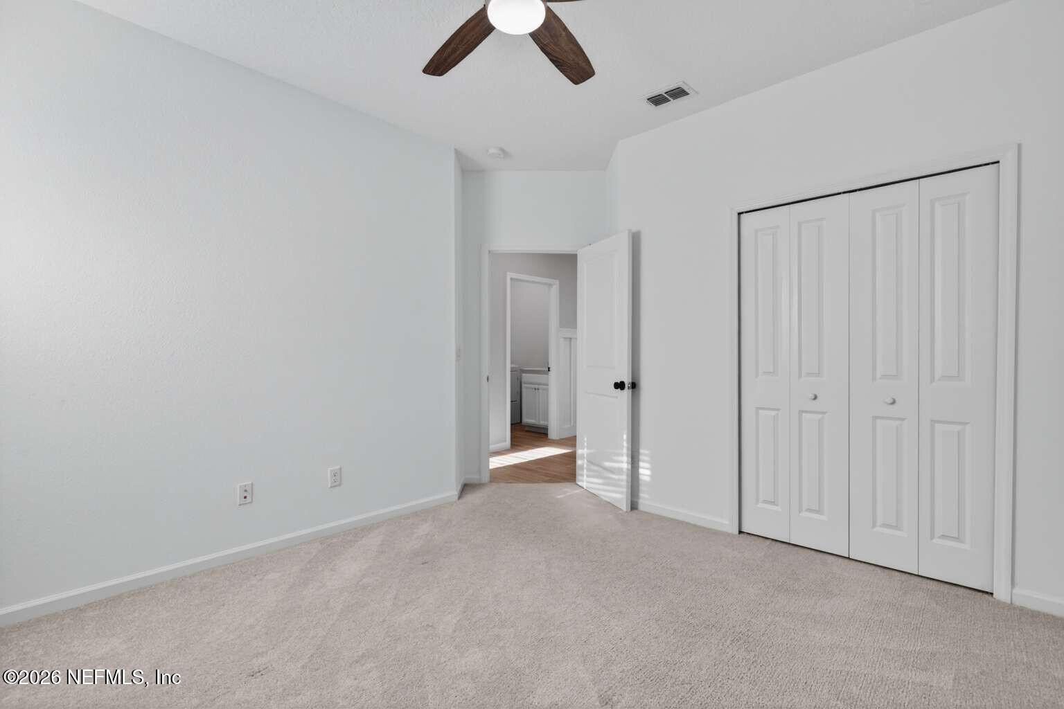 339 Gan Way St. Johns, FL 32259 - Photo 14 of 20 an empty room with chandelier fan