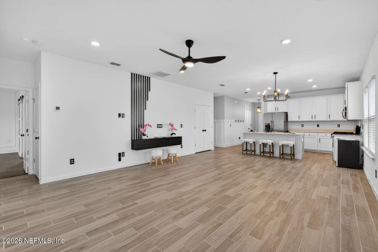 339 Gan Way St. Johns, FL 32259 - Photo 7 of 20 a large kitchen with stainless steel appliances kitchen island granite countertop a stove and a refrigerator
