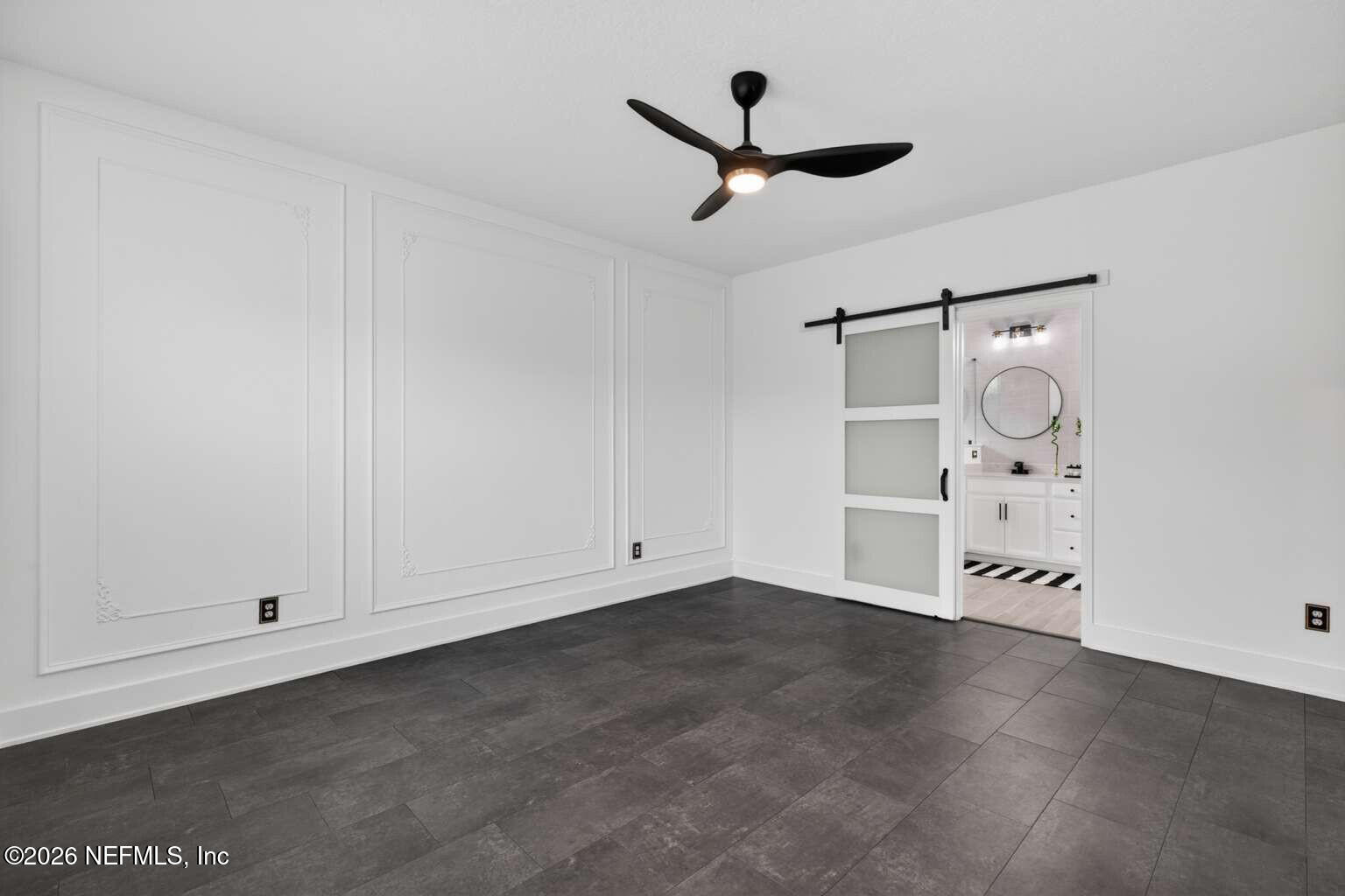 339 Gan Way St. Johns, FL 32259 - Photo 10 of 20 an empty room with cabinet and ceiling fan