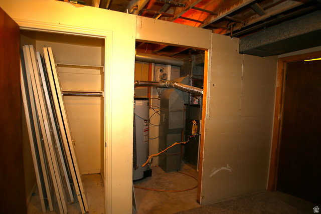 1612 East 450 South Springville, UT 84663 - Photo 44 of 48 Utility area featuring a water heater, furnace, and exposed ceiling joists