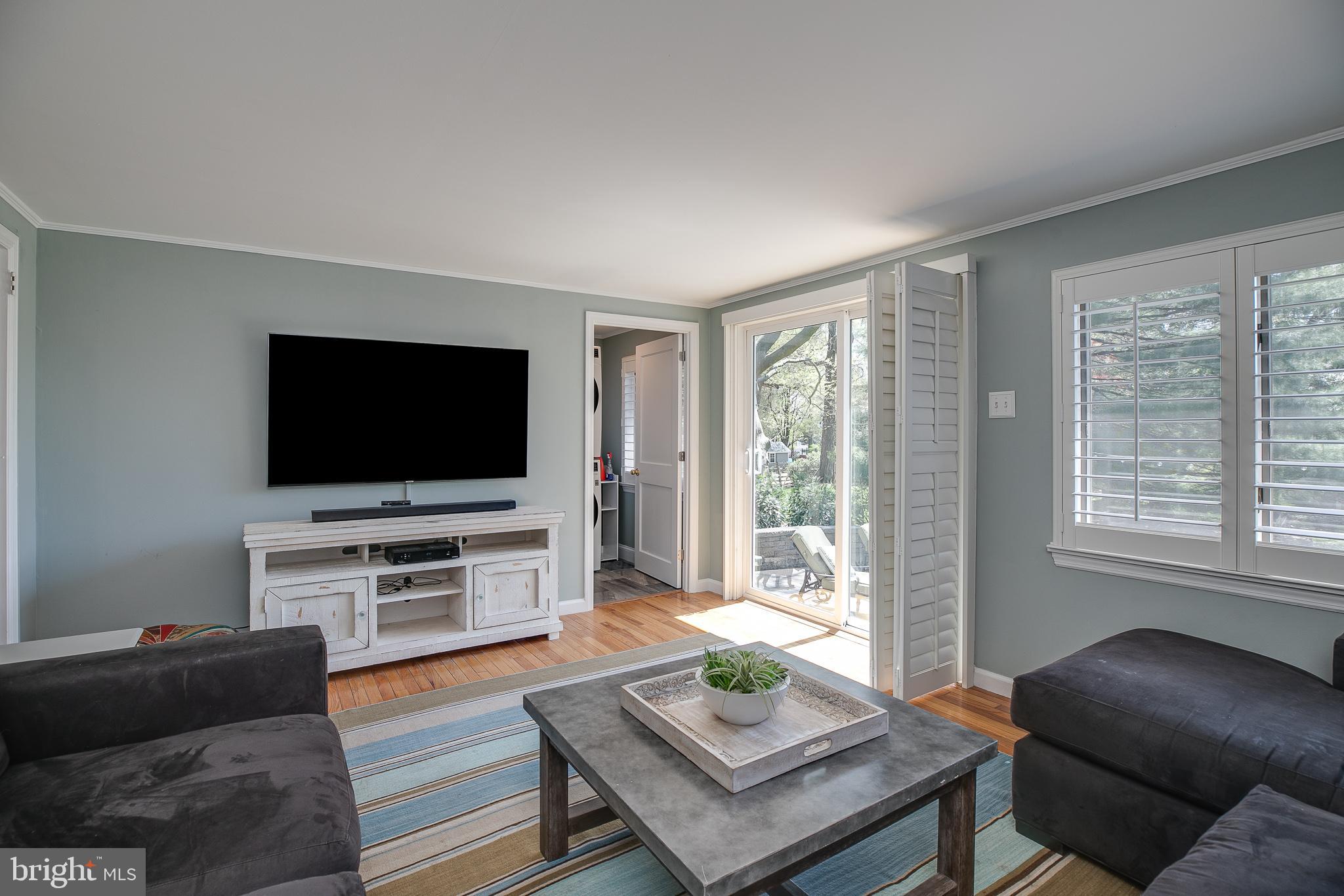 330 Old Lancaster Road Devon, PA 19333 - Photo 15 of 31 a living room with furniture and a flat screen tv