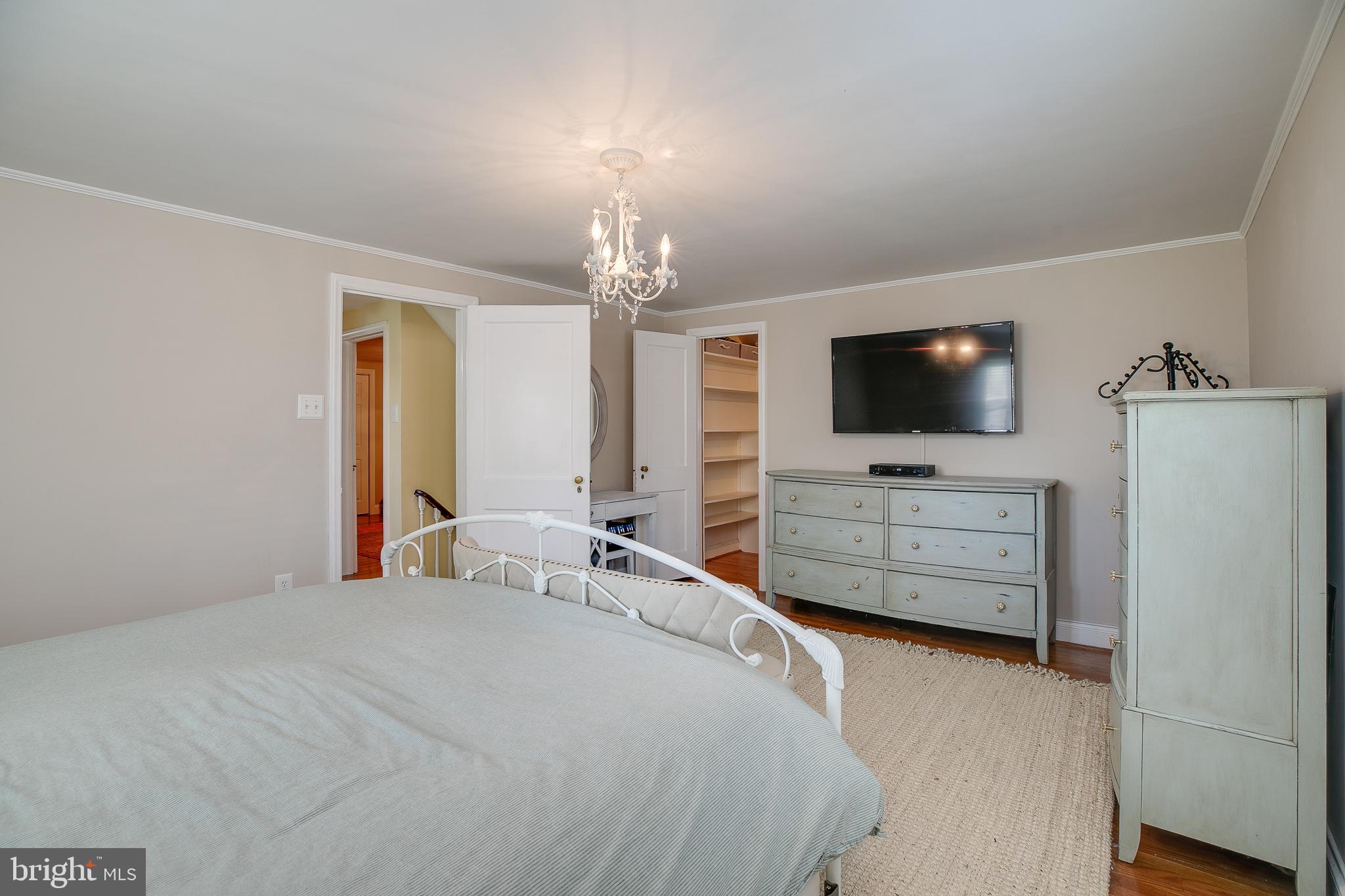 330 Old Lancaster Road Devon, PA 19333 - Photo 22 of 31 a bedroom with furniture and flat screen tv