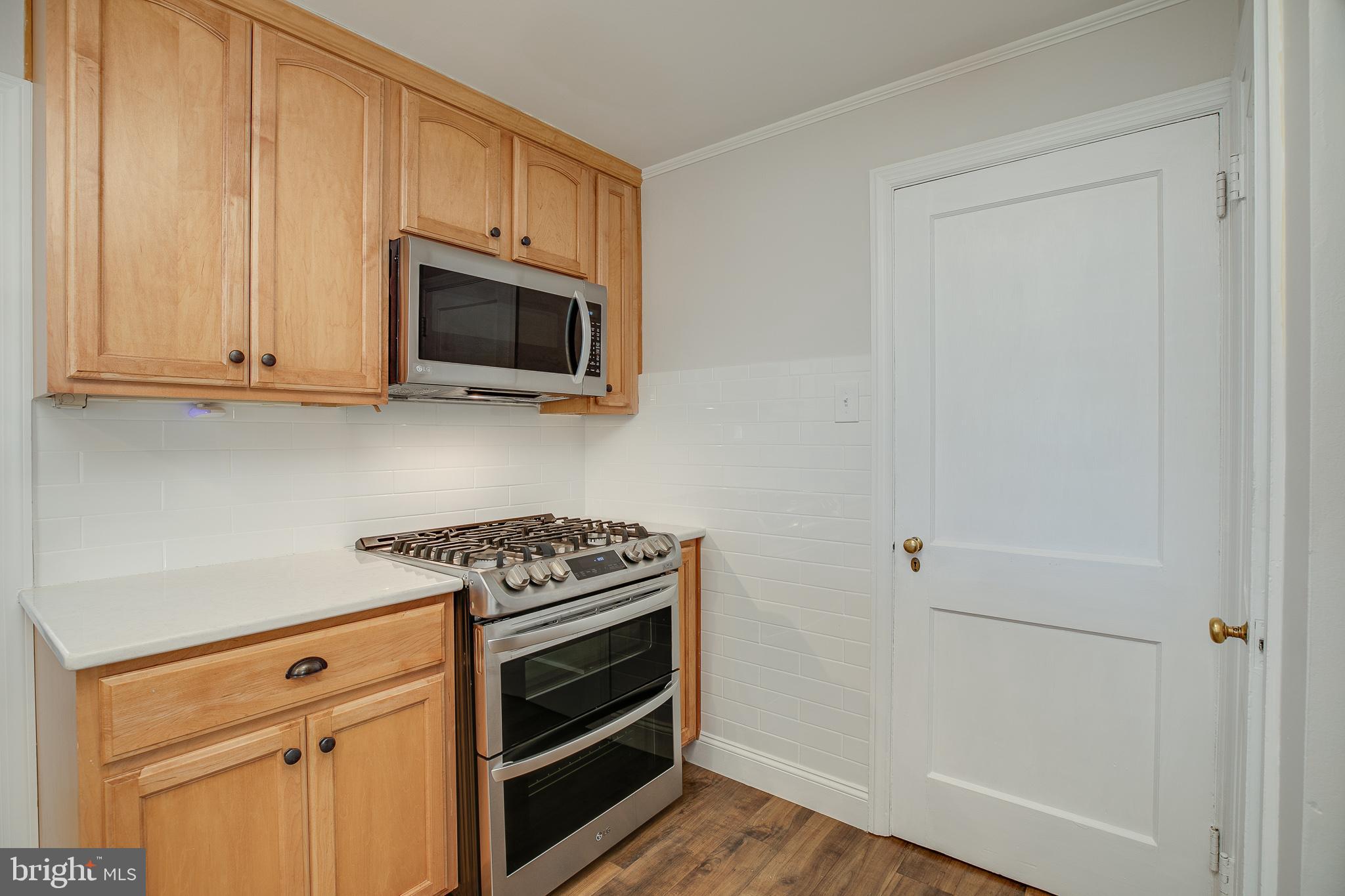 330 Old Lancaster Road Devon, PA 19333 - Photo 10 of 31 a kitchen with microwave cabinets and a stove top oven