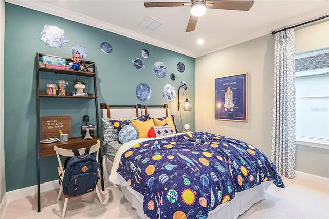 a bedroom with a bed and a chandelier