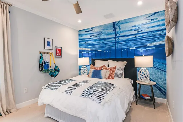 a living room with furniture and a ceiling fan