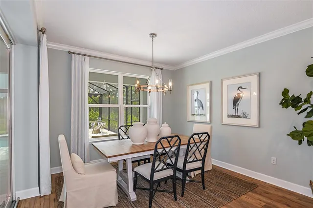 a dining room with furniture and window