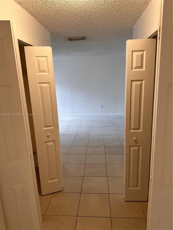 an empty room with a empty space and a window