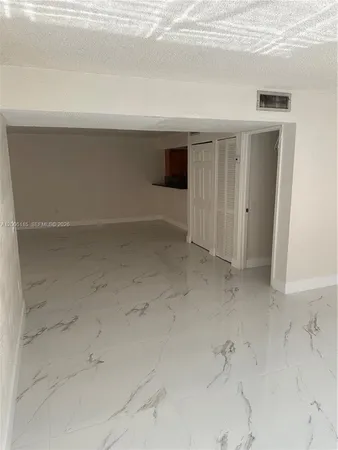 a bathroom with a sink mirror and toilet