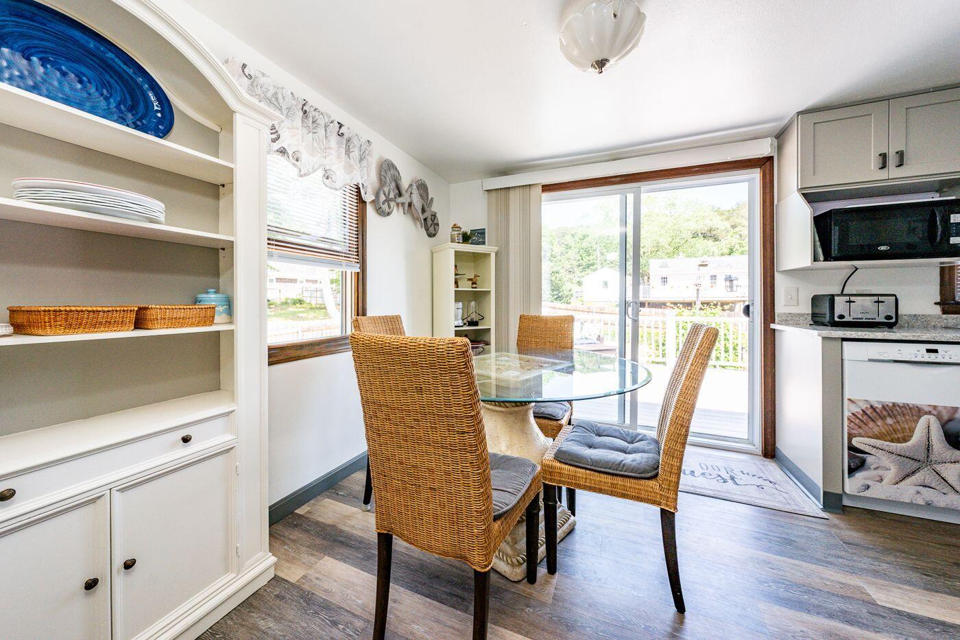 106 Old Great Neck Road Mashpee, MA 02649 - Photo 4 of 21 a view of a a dining room with furniture window and wooden floor