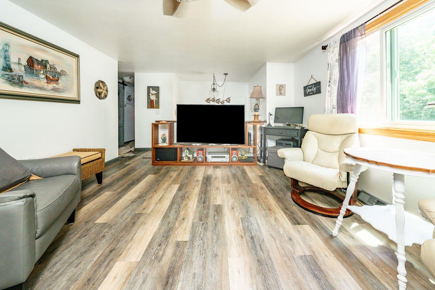 106 Old Great Neck Road Mashpee, MA 02649 - Photo 5 of 21 a living room with furniture and a flat screen tv