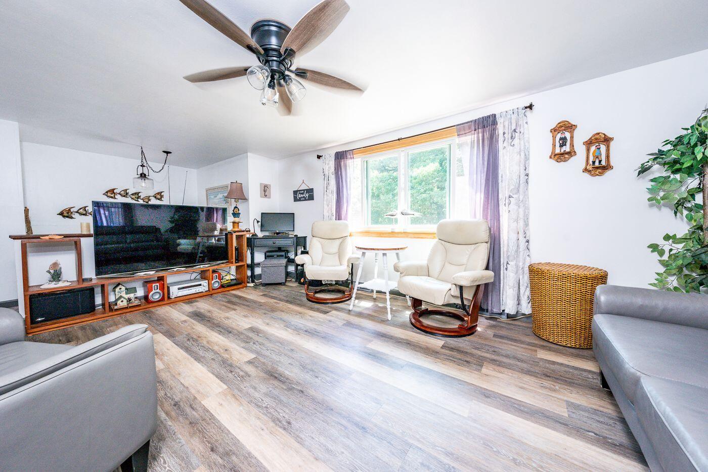 106 Old Great Neck Road Mashpee, MA 02649 - Photo 6 of 21 a living room with furniture and a flat screen tv